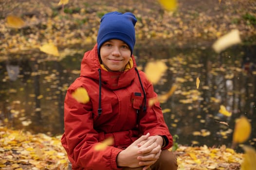 Autumn portrait of boy teen on fall nature background