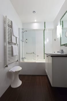 hotel bathroom in white tones. vertical shot