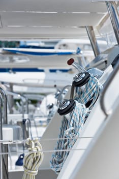 Winches and ropes, sailing yacht detail. Vertical shot