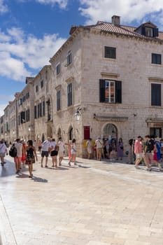Dubrovnik, Croatia - June 27, 2023: Tourists walking on the Stradun street also called Placa, the main street in the city