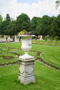 Planter as decoration on a meadow in a well-kept public park in Cologne
