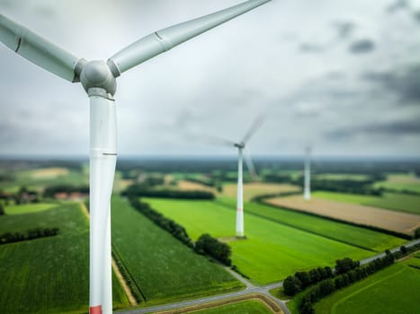 aerial view of some wind turbines in a rural landscape