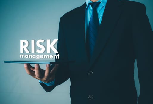 Person use tablet with virtual icon of Risk analysis in business decisions, Risk management concept, Risk control and management strategies for risky businesses.