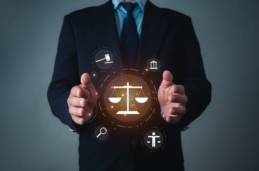 Businessman holding virtual global law icons on for business legal advice, Labor law, Lawyer, Attorney at law, Legal advice business concept, Lawyer icon, Lawyer man, Lawyer background.