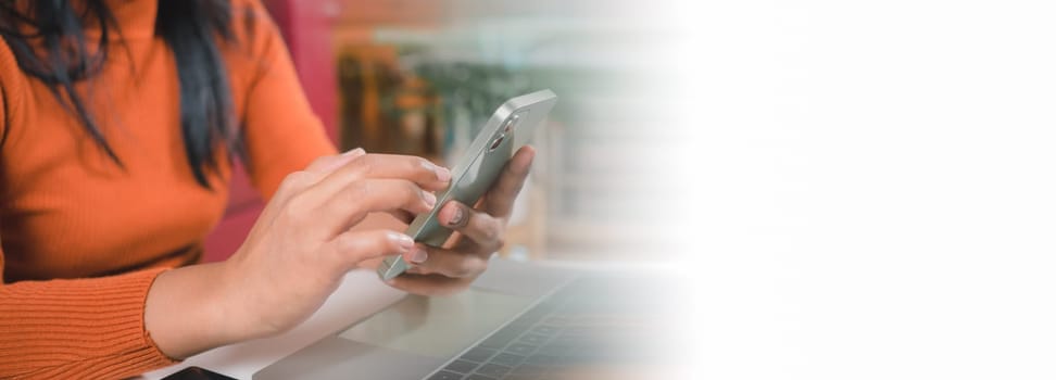 Asia women working business SME online at home her checking order from smartphone  for customer and online delivery for ready packing, Checking orders from customers with digital laptop.