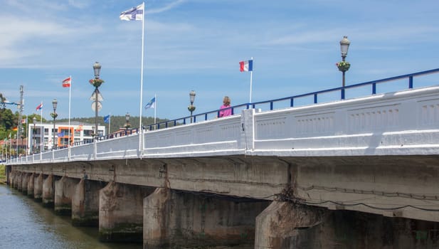 Ribadesella, Spain - July 13th, 2024: Ribadesella river bridge, that divides the fishing port in two, Asturias, Spain