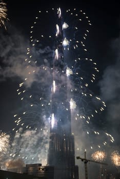 DUBAI, UAE - JANUARY 01: New Year Celebrations Fireworks at Burj Khalifa world's tallest tower at Dubai Downtown on January 01, 2015 in Dubai, United Arab Emirates