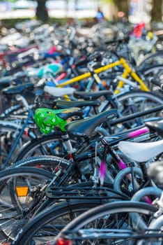 SWITZERLAND, ZURICH - AUGUST 22: The big number of old city bicycles on a parking on August 22, 2015. Small GRIP