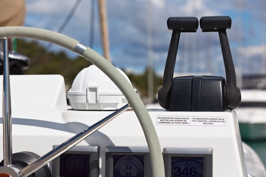 Sailing yacht control wheel and implement. Horizontal shot without people