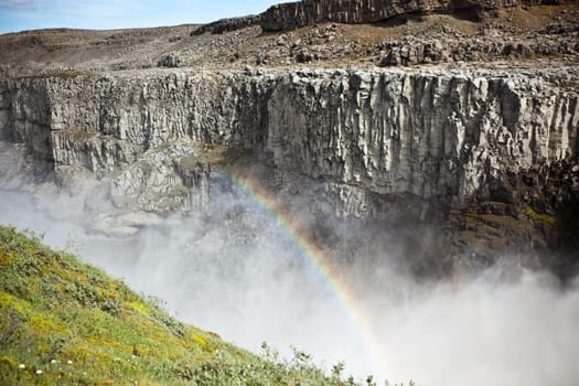 Dettifoss Waterfall in Iceland with rainbow. Horizontal shot