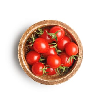 Small red cherry tomatoes in bowl isolated on a white background.