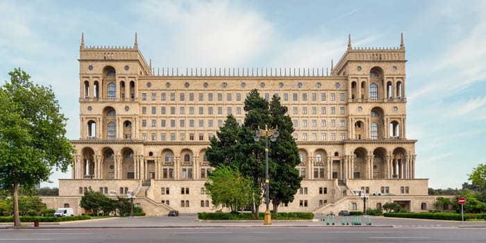 The grand facade of the Government Palace of Azerbaijan in Baku, showcasing elegant architecture against a clear blue sky