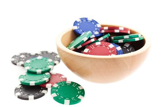 multicolor poker chips bowl isolated on white background. closeup horizontal shot. another similar shots available