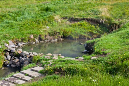 Hot spring outdoor bath in Iceland. Nordic calm nature