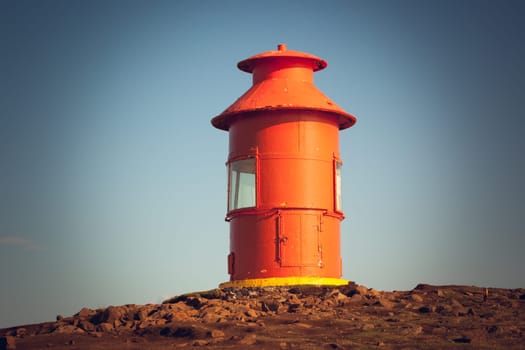 Red Lighthouse on a hill above Stykkisholmur, the western part of Iceland