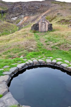 Hot spring outdoor bath in Iceland. Nordic calm nature