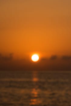 Defocused tropical sunset background. Blur abstract shot