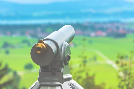 Filtered Image of a telescope overlooking for rural landscape. Selective focus