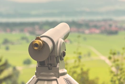 Filtered Image of a telescope overlooking for rural landscape. Selective focus