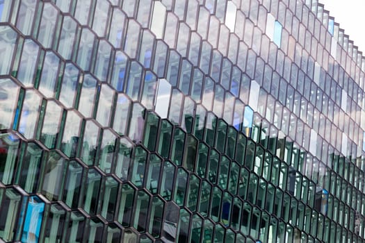 Detail of the glass facade of the Harpa Concert Hall in Reykjavik, Iceland.