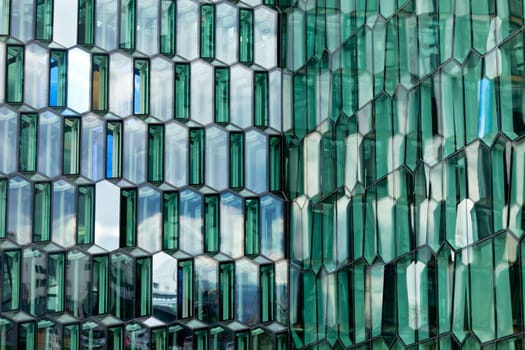 Detail of the glass facade of the Harpa Concert Hall in Reykjavik, Iceland.