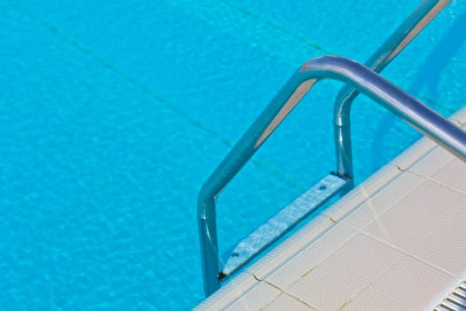 Ladder of a swimming pool. Horizontal shot