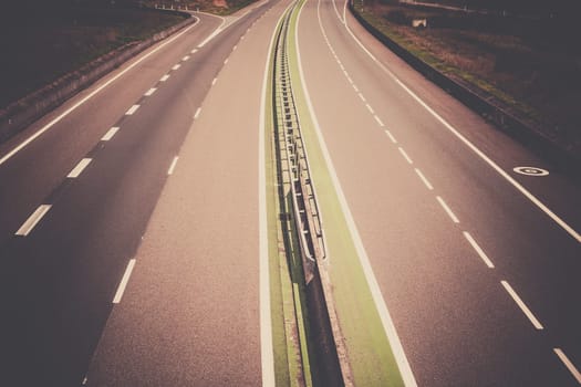 Highway through France at summer time. Top view. Filtered shot