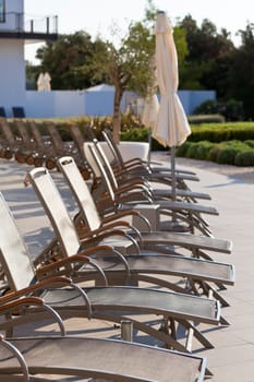 Hotel Poolside Chairs Row. Vertical shot
