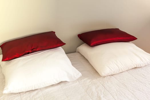 Prepared fresh bed, scene in apartments room. Horizontal shot
