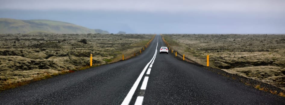 Highway N1 through Iceland landscape at foggy day. Long banner