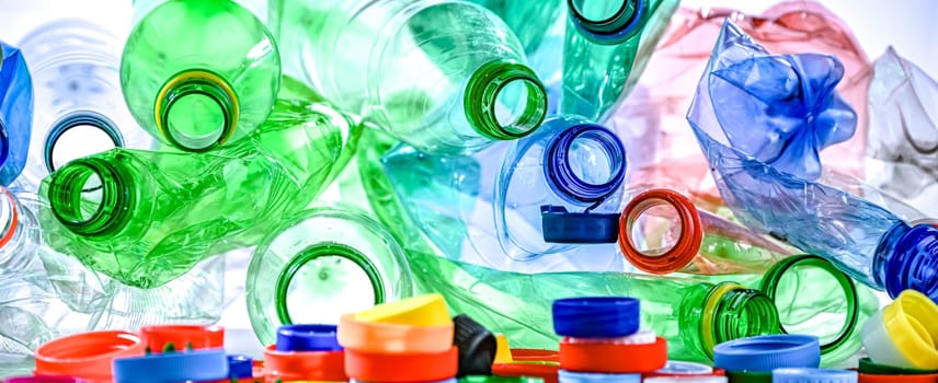Empty colored drink bottles. Recyclable plastic waste.