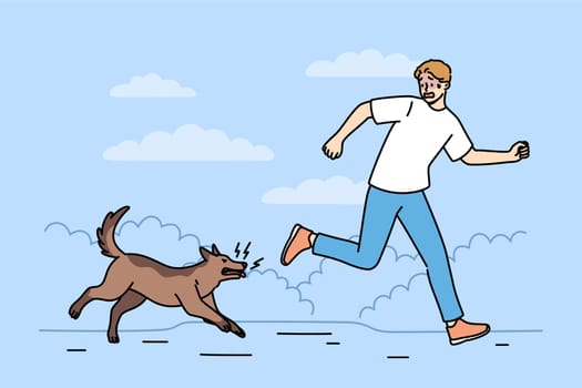Man runs away from angry barking dog infected with rabies and lunging at passers-by. Dog chases cowardly guy because of intrusion into chat territory or bad attitude towards animals
