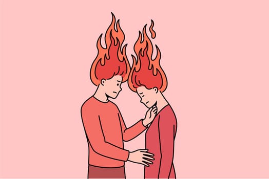 Emotional burnout of family couple with fire above heads, for concept of relationship problems. Man and woman need family psychologist after quarrel and disagreements with partner.
