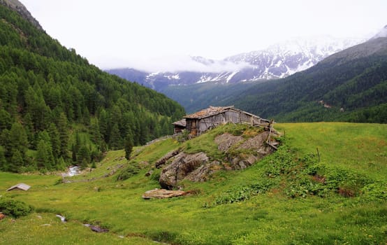An old farmhouse in the beautiful mountain landscape of Italy