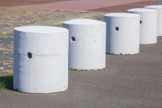 Concrete bollards on a road, Germany