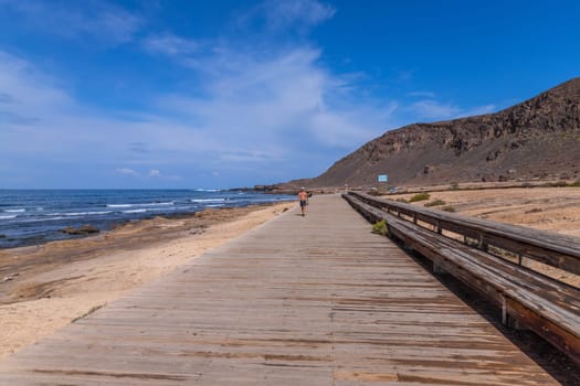 Gran Canaria, Spain: March 3, 2024: People at el Confital beach on the edge of Las Palmas, La Isleta peninsula. Gran Canaria, Spain