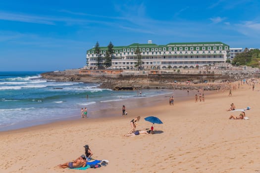 Sintra, Portugal: April 13, 2024: People at Praia do sul beach, Ericeira, Sintra, Lisbon coast, Portugal