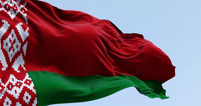 Close-up of national flag of Belarus waving in the wind on a clear day. Red and green flag with a white and red ornament pattern placed at the staff end.3d illustration render. Fluttering textile