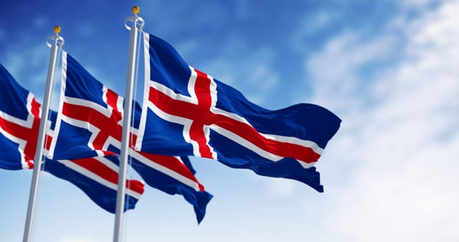 Close-up of three Iceland national flags waving. Blue with a white cross and a red cross inside the white cross. Seamless 3d render animation. Slow motion loop. Selective focus