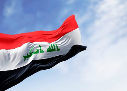 Republic of Iraq national flag waving on a clear day. Three horizontal red, white, and black stripes with a green Takbir text. 3d illustration render. Rippling fabric. Close-up