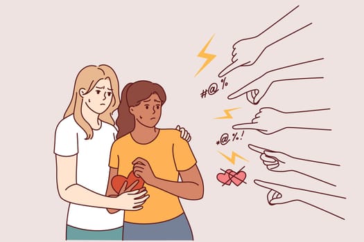 Discrimination against LGBT couple of two lesbian women who need protection from hands of homophobia people. Problem homophobia in society and lack of promotion of tolerance towards non-binary couples