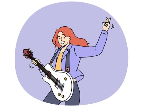 Woman with guitar plays rock music at concert and enjoys creative hobby and winks looking at screen