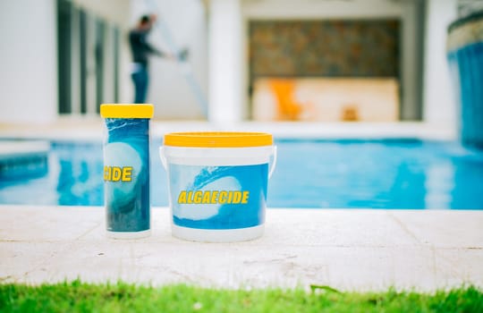 Algaecide for swimming pools. Algaecide and clarifier for cleaning swimming pools