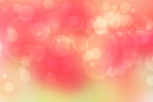 A festive abstract delicate gold yellow red orange background texture with defocused bokeh circles and stars. Card concept for Happy New Year, party invitation, valentine or other holidays.