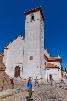 Granada, Spain: April 15, 2024: People at the Albaicin Moorish medieval quarter, traditional arabic architecture of Andalusia. Granada, Spain