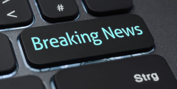 Illuminated keyboard with a labeled key - Breaking News