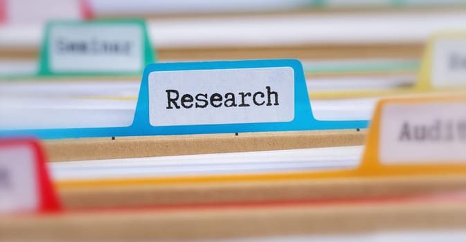 File folders with a tab labeled Research
