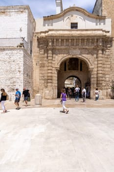 Polignano a Mare, Italy, Apulia - May 24, 2024: Arco Marchesale (Porta Vecchia) located in Piazza Giuseppe Verdi. It was fortified structure built around a medieval settlement