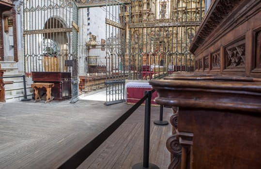 Coria, Spain - August 31th, 2023: Coria Cathedral of Our Lady of Assumption, Caceres, Spain. Main altarpiece seen from choir