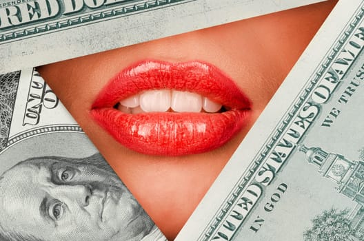 Beautiful female lips closeup behind doolars background